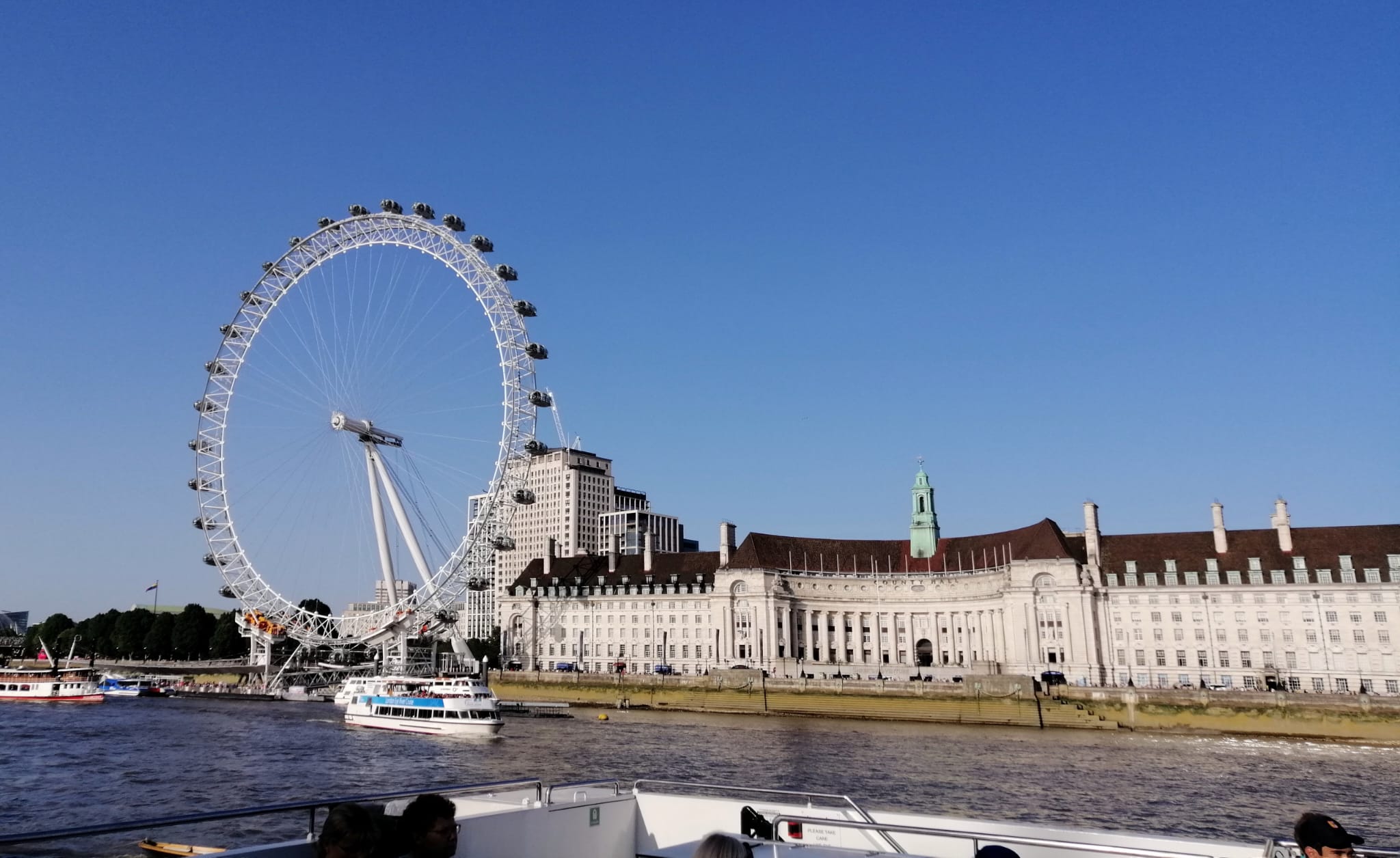 London Eye seen from Thames river cruise