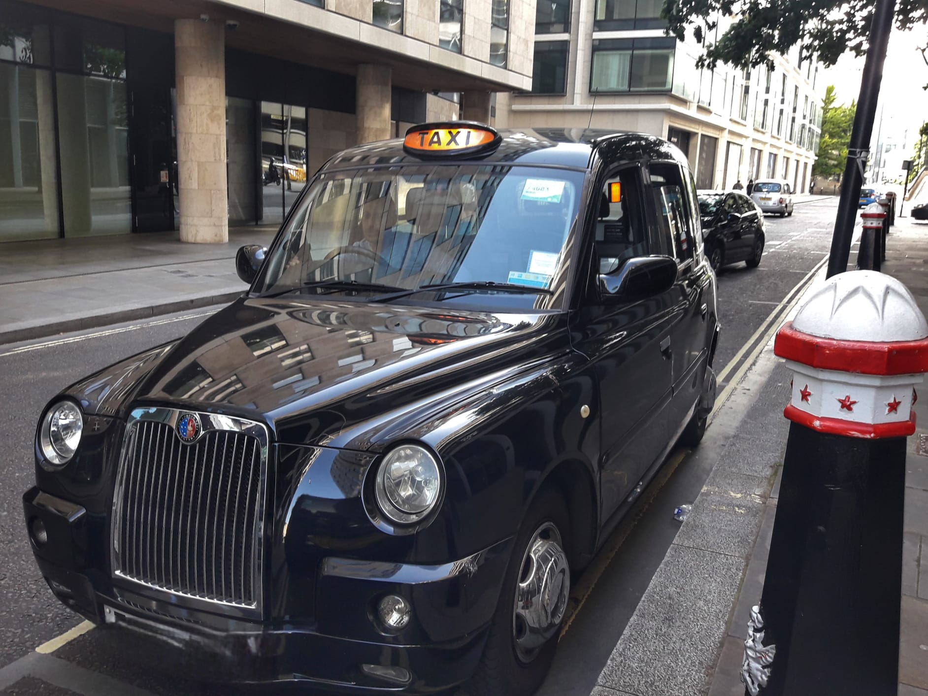 Interior or exterior of a classic black cab in London