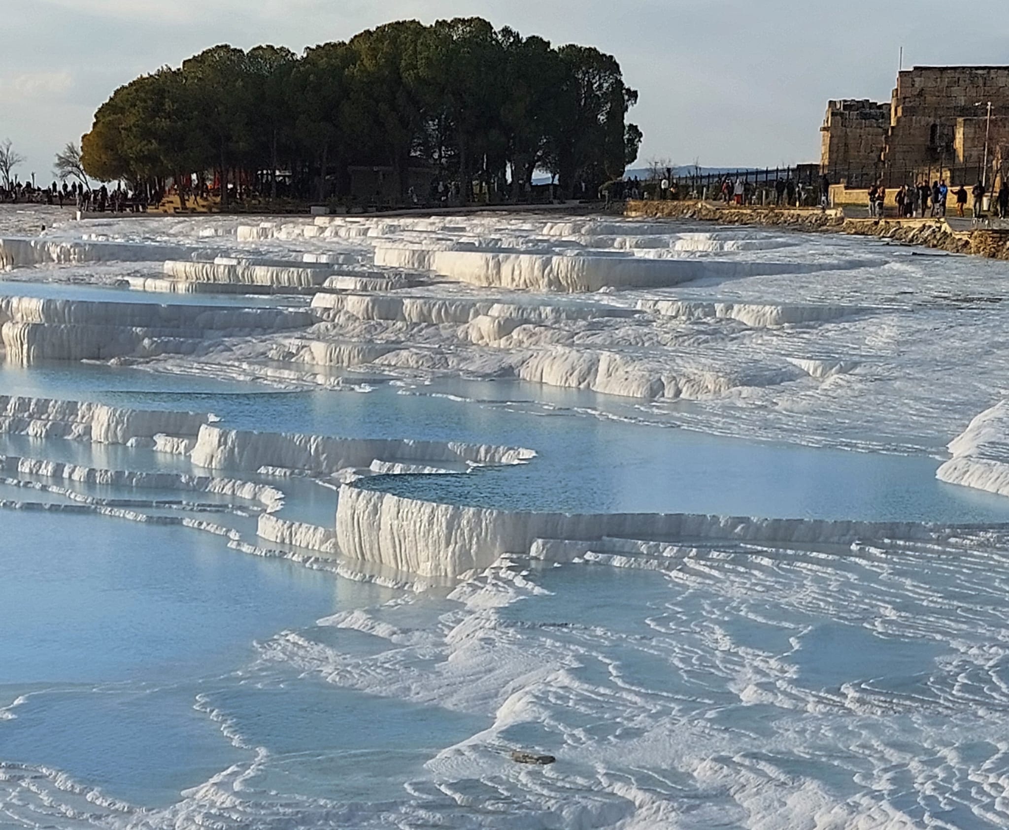 White travertine terraces and turquoise waters in Pamukkale
